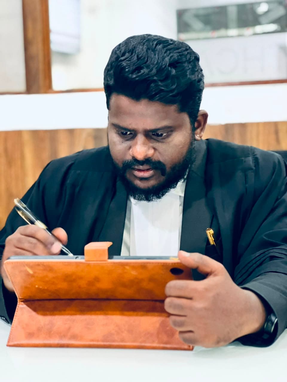 Advocate Chappidi Ramakrishna at Solariss Law Associates office